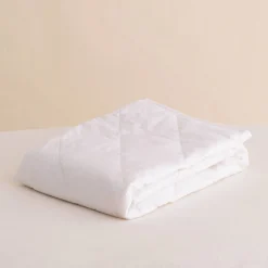 The Sleep Store Quilted Cotton Basket Topper