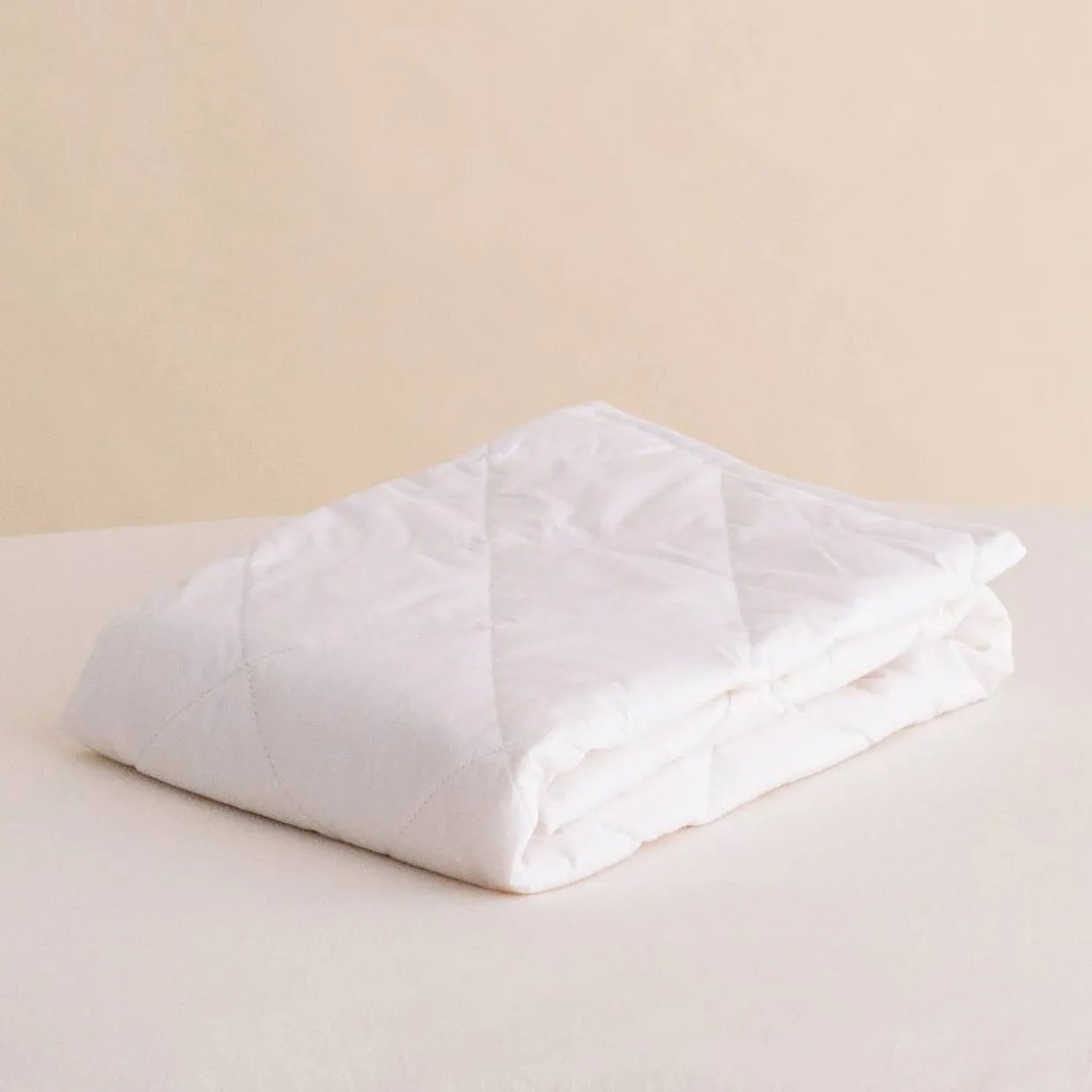 The Sleep Store Quilted Cotton Basket Topper